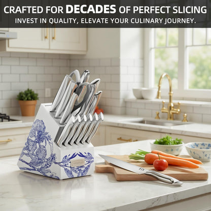 KnifeSaga 15-piece kitchen knife set with white and blue floral ceramic knife block in bright modern kitchen with marble counter, fresh vegetables and stainless steel chef knife on cutting board