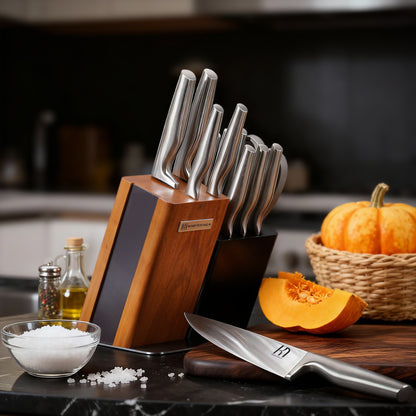 Set of knives in a wooden block on a kitchen counter with a pumpkin and salt.