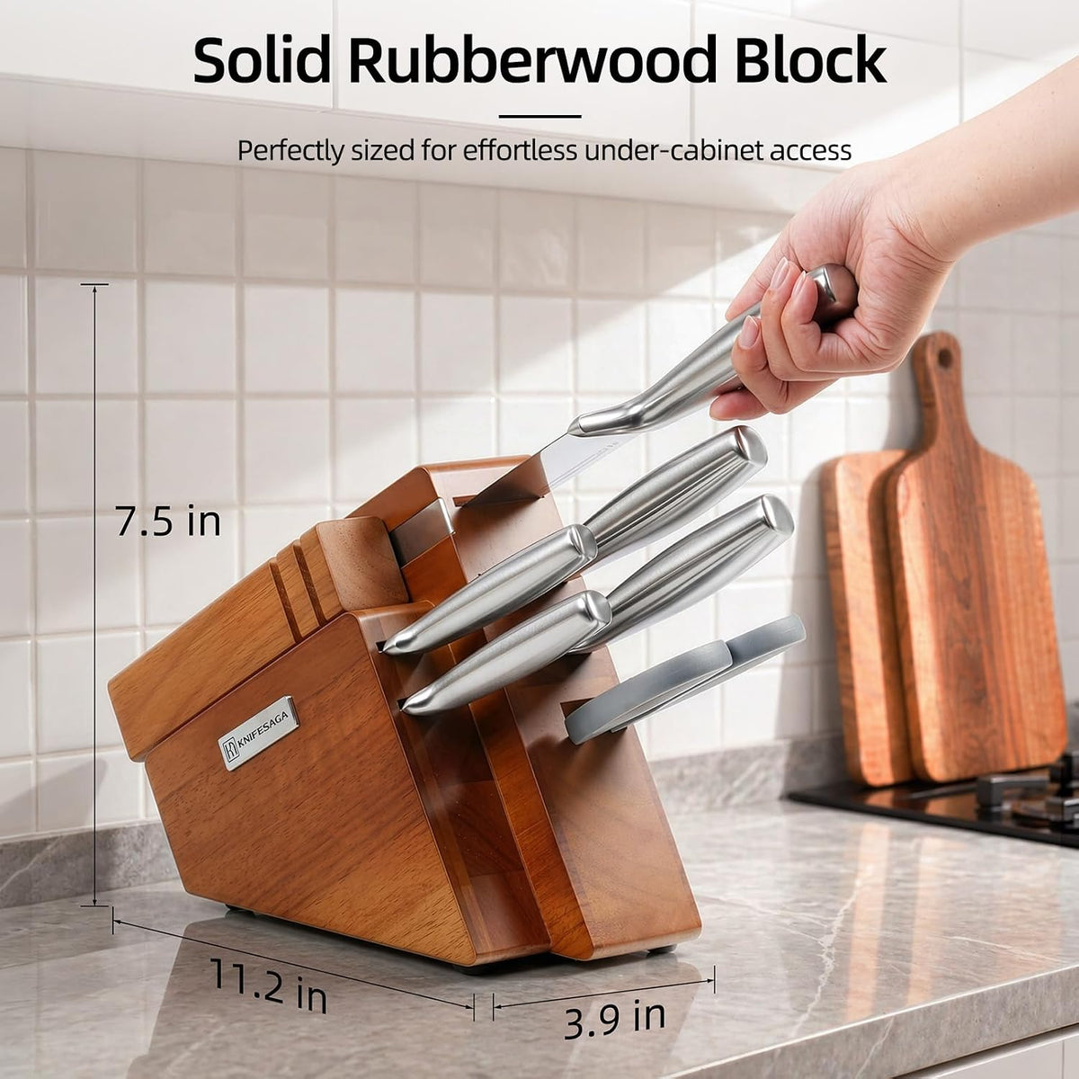 Hand pulling a knife from the KnifeSaga solid rubberwood knife block on kitchen counter, low-profile 11.2 x 3.9 x 7.5 inch design for under-cabinet storage